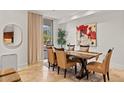 Elegant dining area with modern table, seating for six, and stylish decor at 2402 E Esplanade Ln # 204, Phoenix, AZ 85016