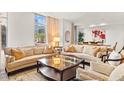 Bright and airy living room with comfortable seating and views of the city at 2402 E Esplanade Ln # 204, Phoenix, AZ 85016