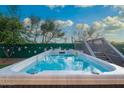 Sparkling in-ground pool featuring a sleek design and a wooden deck for lounging under the Arizona sun at 29228 N 48Th St, Cave Creek, AZ 85331