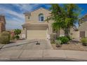 Two-story home with desert landscaping, tile roof, and a two-car garage at 29399 N 67Th Ave, Peoria, AZ 85383