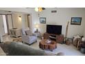 Cozy living room with comfortable seating, stylish decor, and tile flooring at 3345 E University Dr # 47, Mesa, AZ 85213