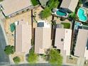 A high angle aerial view of several homes with tile roofs, patios, private pools and desert landscaping at 4045 E Desert Marigold Dr, Cave Creek, AZ 85331