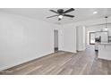 Spacious living area with wood-look flooring and an open layout to the kitchen at 432 W 1St St, Mesa, AZ 85201