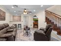 Stylish living room with fireplace, leather furniture, and a cozy atmosphere at 4347 N 24Th Way, Phoenix, AZ 85016