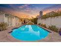 Backyard oasis featuring a sparkling swimming pool, perfect for relaxation and entertainment at 4596 E Calle Ventura --, Phoenix, AZ 85018