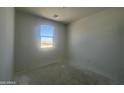 Bright bedroom with sunlit window offers a serene space at 47719 W Moeller Rd, Maricopa, AZ 85139
