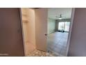 Bedroom featuring neutral colored walls and tile flooring with a closet at 650 N 65Th Way, Mesa, AZ 85205