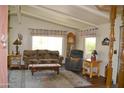 Comfortable living room featuring western decor, wood floors, and natural lighting at 8310 E Deep Canyon Ct, Mesa, AZ 85208