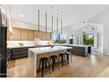 Spacious modern kitchen with a large island, sleek cabinetry, and stainless steel appliances at 10875 E Mirasol Cir, Scottsdale, AZ 85255