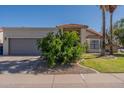 Home featuring a two-car garage and desert landscaping at 1109 E San Pedro Ave, Gilbert, AZ 85234