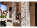 Close-up of modern, rustic house number and decorative flower box detail at 1120 N Val Vista Dr # 110, Gilbert, AZ 85234