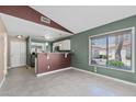 Bright, open living space featuring neutral tile, large windows, and kitchen access at 1120 N Val Vista Dr # 110, Gilbert, AZ 85234