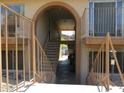 This apartment's stairwell features brick archways, iron railings and a view to the outdoors in this well maintained community at 1130 E Butler Dr # B4, Phoenix, AZ 85020
