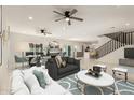Spacious living room with a staircase, combined with modern furniture and decor at 1131 E Bishop Dr, Tempe, AZ 85282