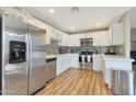 A modern kitchen featuring stainless steel appliances, white cabinets, and light countertops at 15050 N Thompson Peak Pkwy # 2072, Scottsdale, AZ 85260