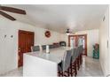 Spacious dining area with long countertop and seating for ten at 2207 N 53Rd Ave, Phoenix, AZ 85035
