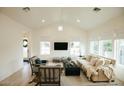 Airy living room with vaulted ceilings, a modern fireplace, lots of natural light, and stylish furnishings at 419 W 11Th St, Tempe, AZ 85281