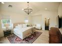 Spacious bedroom featuring soft neutral tones, a sitting area, a plush bed, and lots of natural light at 419 W 11Th St, Tempe, AZ 85281
