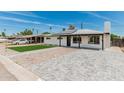 Beautiful home with a lush lawn, solar panels, a stylish walkway, and ample parking space at 4531 N 12Th Dr, Phoenix, AZ 85013