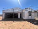 Image showing the exterior of a home in the construction phase with scaffolding and unfinished walls at 47720 W Kenner Dr, Maricopa, AZ 85139