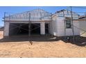 Exterior shot of a home under construction with scaffolding and unfinished facade at 47720 W Kenner Dr, Maricopa, AZ 85139