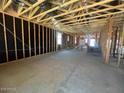 Interior view showcasing the framing of the home, highlighting the raw construction of the walls and ceiling at 47720 W Kenner Dr, Maricopa, AZ 85139