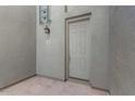 Exterior view of a unit's front door with a lantern-style light fixture and unit number 261 at 615 E Portland St # 261, Phoenix, AZ 85004