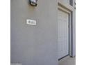 Close up of modern gray front door with unit number 261 above the door at 615 E Portland St # 261, Phoenix, AZ 85004
