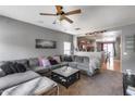 Spacious living area featuring a sectional sofa, neutral walls, and carpeted floors at 6328 W Fawn Dr, Laveen, AZ 85339