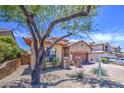 Charming home with mature tree, tile roof, and low-maintenance landscaping at 6941 E Snowdon St, Mesa, AZ 85207