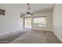 Cozy living room with sliding glass door and lots of natural light at 6941 E Snowdon St, Mesa, AZ 85207