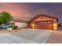 Attractive single-story home featuring desert landscaping, a two-car garage, and a cozy, neighborhood setting at 8433 E Natal Cir, Mesa, AZ 85209