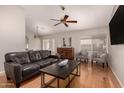 Comfortable living room with hardwood floors, ceiling fan, and great natural light at 901 N Quartz St, Gilbert, AZ 85234