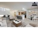 Bright, staged living space with open floor plan, breakfast bar, and dining area perfect for modern living at 9705 E Mountain View Rd # 1096, Scottsdale, AZ 85258