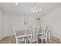 A beautifully staged dining room with a chandelier and a formal dining set at 1207 E Clearview Dr, Casa Grande, AZ 85122
