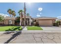 Beautiful home featuring a well-manicured lawn, desert landscaping, and an attached two-car garage at 1207 E Clearview Dr, Casa Grande, AZ 85122