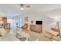 Open-concept living area with modern decor, and a breakfast bar leading to the kitchen at 1241 E Medlock Dr # 112, Phoenix, AZ 85014