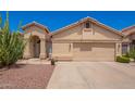 Charming single-story home with a two-car garage and desert landscaping at 1432 W Hopi Dr, Chandler, AZ 85224