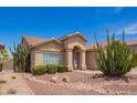 Charming single-story home with desert landscaping and an arched entryway at 1432 W Hopi Dr, Chandler, AZ 85224