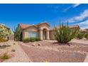 Charming single-story home with desert landscaping and an arched entryway at 1432 W Hopi Dr, Chandler, AZ 85224