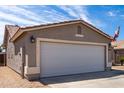 Close up of a two-car garage on an exterior elevation at 15047 W Kings Dr, Surprise, AZ 85374