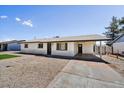 Single story house featuring a covered carport and a low maintenance gravel yard at 15049 N 25Th Pl, Phoenix, AZ 85032