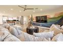 Spacious living room open to the kitchen featuring a custom mural and cozy seating at 1911 E Claremont St, Phoenix, AZ 85016