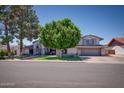 Charming two story home featuring a well-manicured lawn in a suburban neighborhood at 2424 E Ivy St, Mesa, AZ 85213