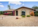 Charming single-story home featuring mature landscaping, desert landscaping, and a well-maintained exterior at 2846 E Lupine Ave, Phoenix, AZ 85028