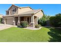 Charming home showcasing a well-manicured artificial lawn and a cozy covered porch area at 2886 E Hazeltine Way, Chandler, AZ 85249