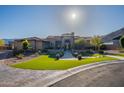Beautiful single-story home features lush green lawn, mature trees, and a welcoming front entrance walkway at 3118 W Glenhaven Dr, Phoenix, AZ 85045