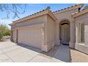 Beautiful home with arched entry, desert landscaping, and a three-car garage at 3544 N Paseo Del Sol --, Mesa, AZ 85207