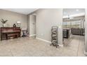 Inviting living area with tile floors, and neutral walls, perfect for relaxation and entertainment at 37645 W Santa Clara Ave, Maricopa, AZ 85138