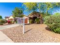 Attractive single-story home with a well-kept front yard and mature trees at 43303 N 44Th Ave, New River, AZ 85087